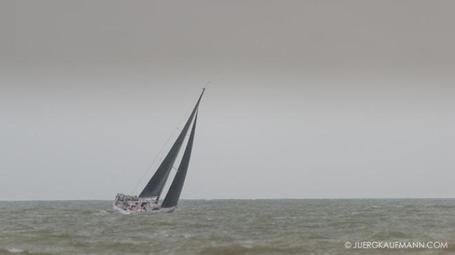 Grey sky and drizzing rain in South China Sea - Round Hainan Regatta 2015 © Juerg Kaufmann Round Hainan Regatta